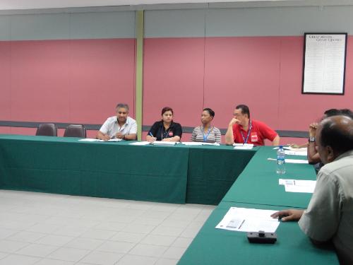 Executive Director, Dr. Robin Maraj, Assistant Manager of ATEC, Malini Bridglalsingh, and Team listen to ideas from lecturers.